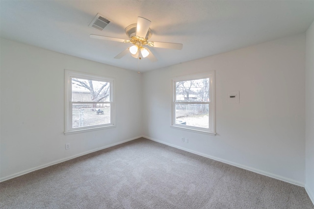 carpeted empty room with ceiling fan