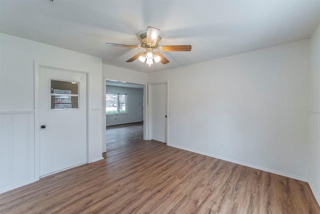 unfurnished room featuring hardwood / wood-style floors and ceiling fan