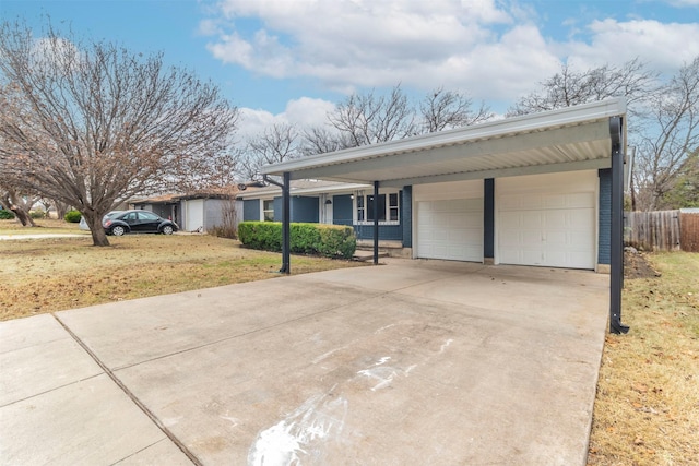 ranch-style house featuring a garage, covered porch, and a front yard