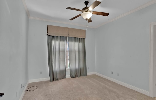 empty room with ceiling fan, ornamental molding, and light carpet