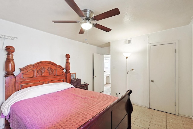 bedroom featuring light tile patterned floors and ceiling fan