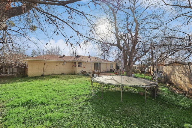 view of yard featuring a trampoline