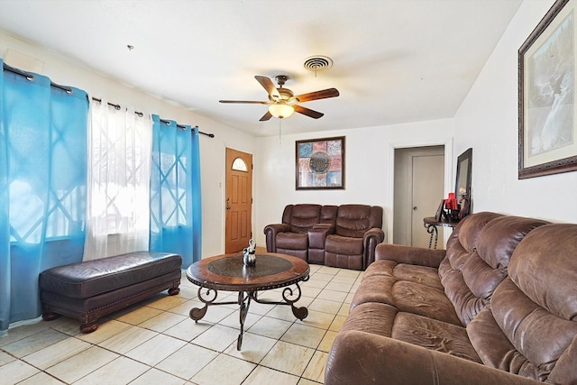 tiled living room featuring ceiling fan