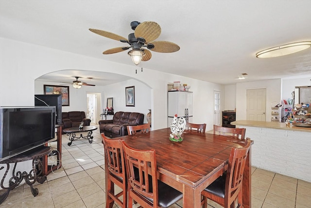 dining room featuring ceiling fan and light tile patterned floors