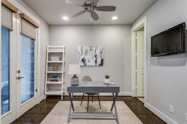 home office with ceiling fan and dark hardwood / wood-style floors