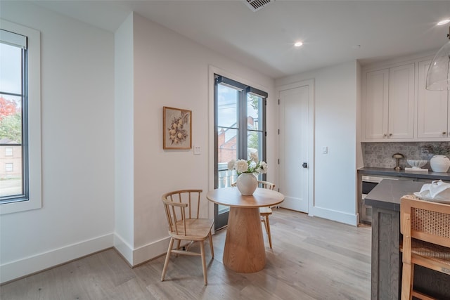 dining area with light wood-type flooring