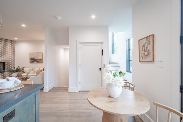 interior space with a fireplace and light wood-type flooring