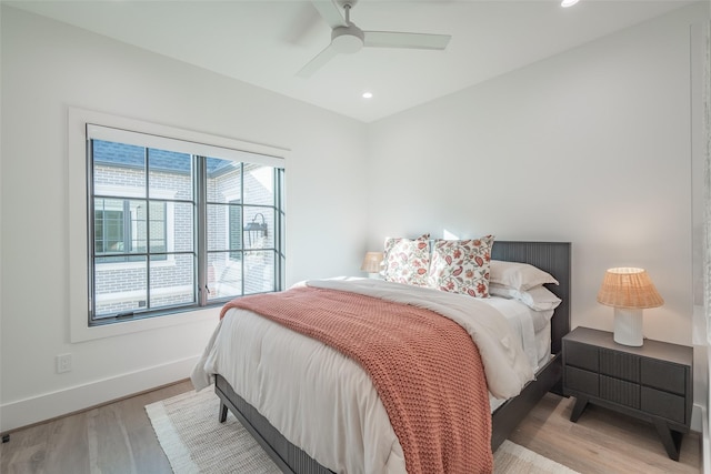 bedroom featuring ceiling fan and light hardwood / wood-style flooring