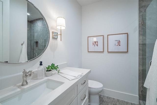 bathroom featuring vanity, toilet, a shower with shower door, and tile patterned flooring