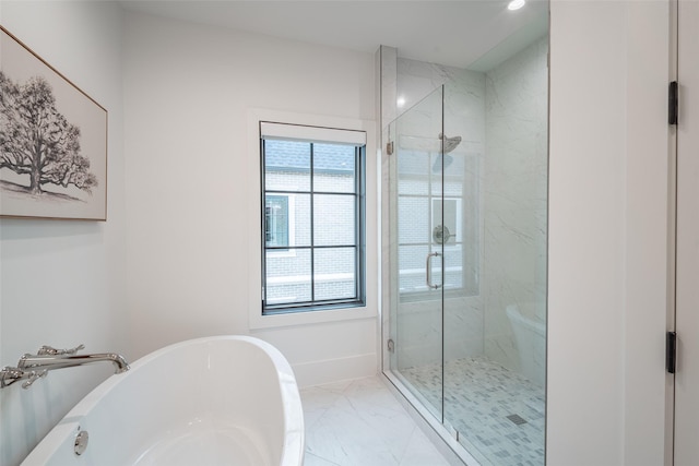 bathroom with separate shower and tub