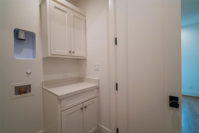 washroom featuring cabinets and hookup for a washing machine