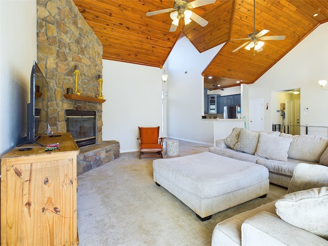 carpeted living room with ceiling fan, a stone fireplace, high vaulted ceiling, and wooden ceiling