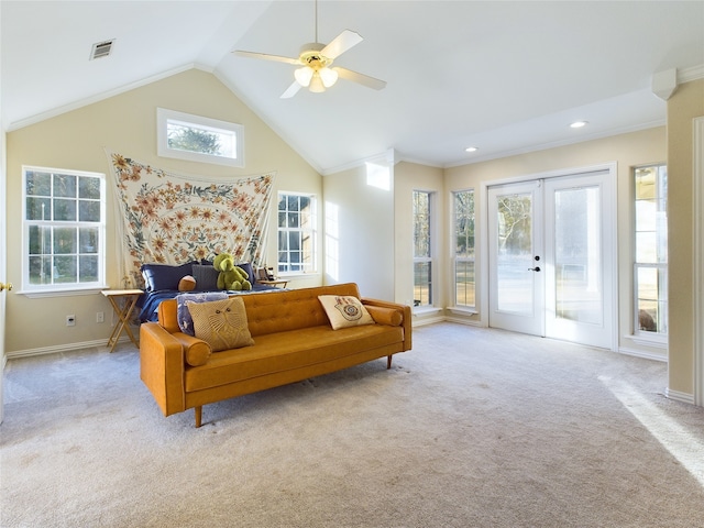 carpeted living room featuring crown molding, high vaulted ceiling, french doors, and ceiling fan