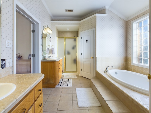 bathroom with ornamental molding, vanity, a shower with door, plenty of natural light, and tile patterned floors