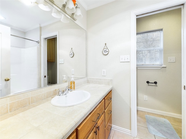 bathroom featuring ornamental molding, tile patterned floors, vanity, and a shower