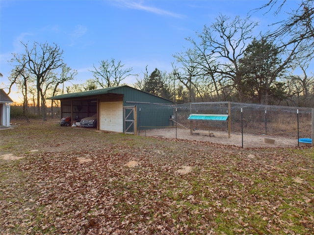 view of outdoor structure at dusk