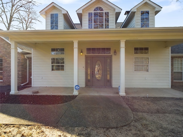 doorway to property featuring a porch