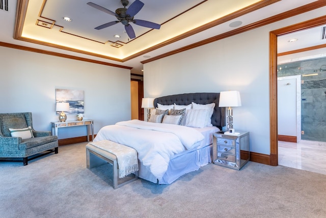 bedroom with a tray ceiling, ornamental molding, light colored carpet, and ceiling fan