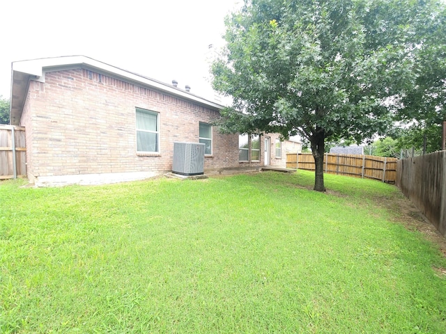 view of yard with central AC unit