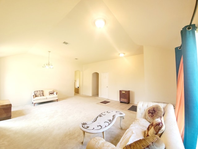 living room with lofted ceiling and light carpet