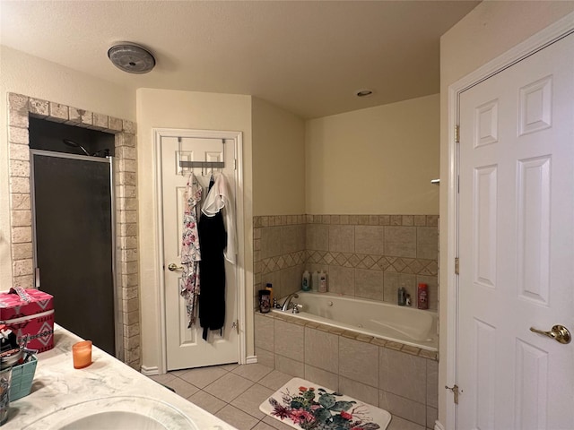 bathroom with vanity, plus walk in shower, and tile patterned flooring