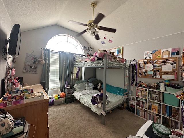 carpeted bedroom featuring lofted ceiling, a textured ceiling, and ceiling fan