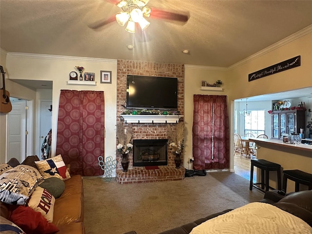 living room with crown molding, a fireplace, a textured ceiling, and carpet