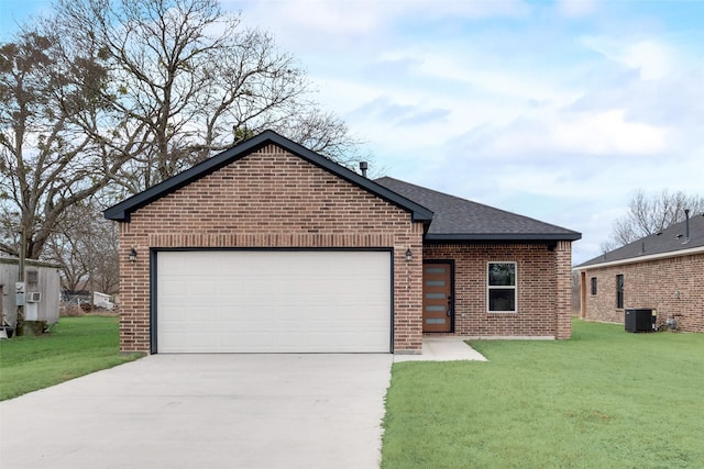 view of front of home featuring a garage, a front yard, and central AC unit