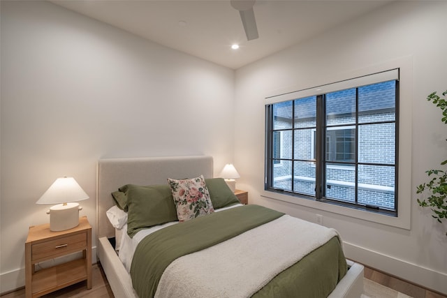 bedroom featuring ceiling fan and hardwood / wood-style floors