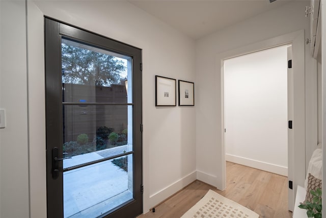 doorway to outside featuring light hardwood / wood-style flooring