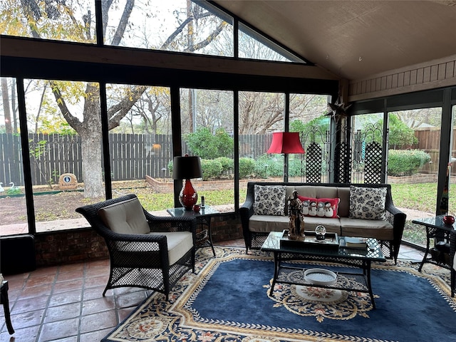 sunroom featuring vaulted ceiling