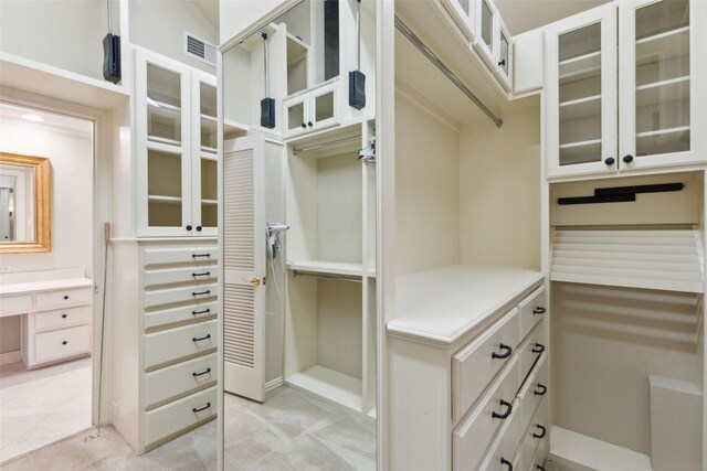 bathroom featuring vanity, ornamental molding, toilet, and walk in shower