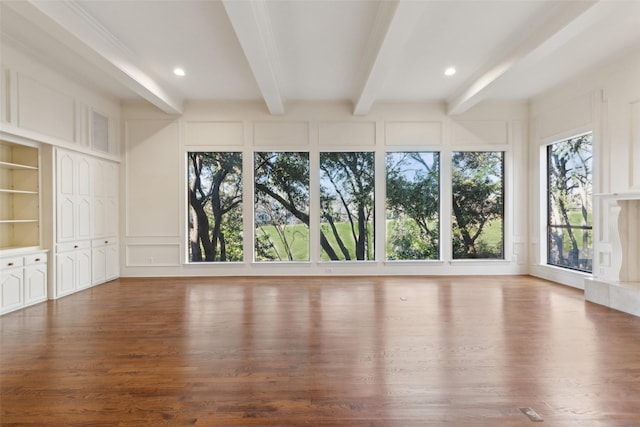 unfurnished sunroom with beamed ceiling