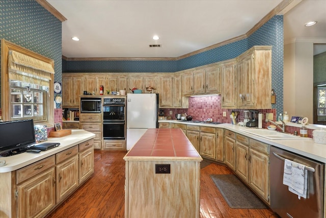 kitchen featuring sink, crown molding, a center island, wood-type flooring, and black appliances