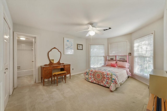 bedroom featuring ceiling fan, light carpet, and a closet