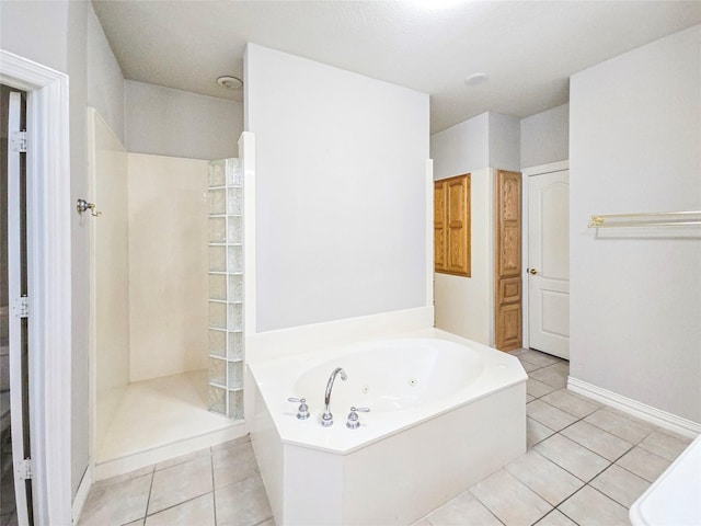 bathroom featuring independent shower and bath and tile patterned flooring