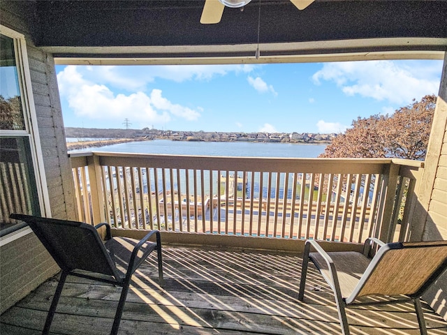 deck featuring a water view and ceiling fan