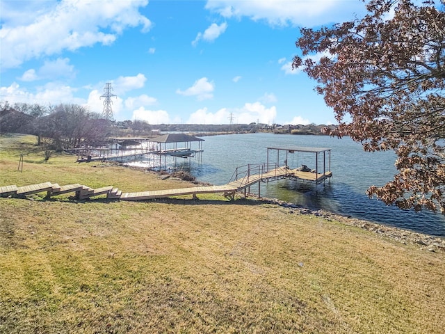 view of dock featuring a yard and a water view