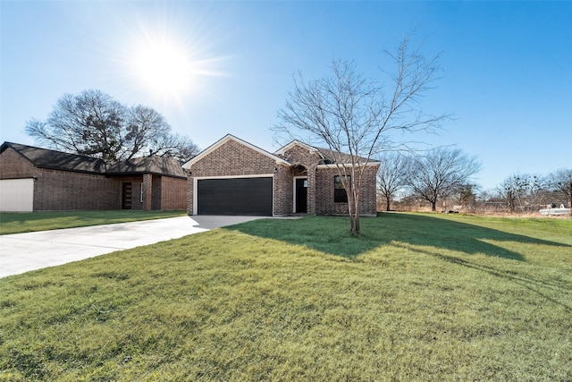 ranch-style home with a garage and a front lawn