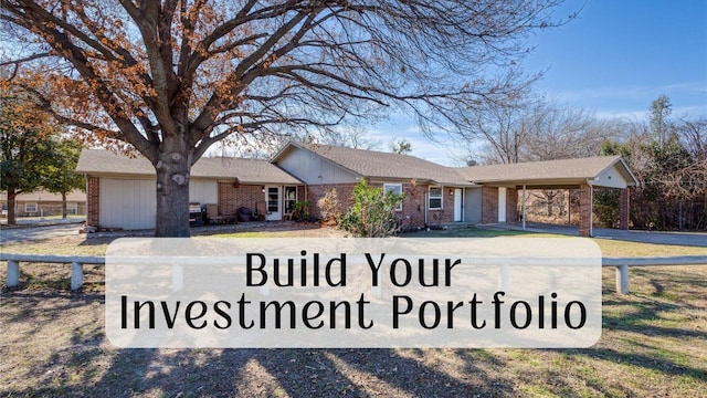 ranch-style home with a garage and a front yard