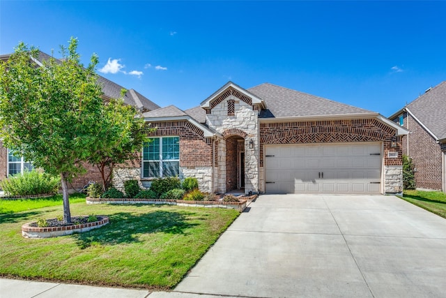 view of front of home with a garage and a front yard