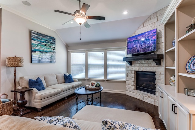 living room with ceiling fan, lofted ceiling, dark hardwood / wood-style floors, and a fireplace