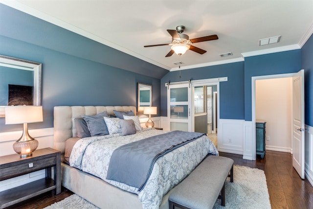 bedroom with vaulted ceiling, ornamental molding, dark hardwood / wood-style flooring, and ceiling fan