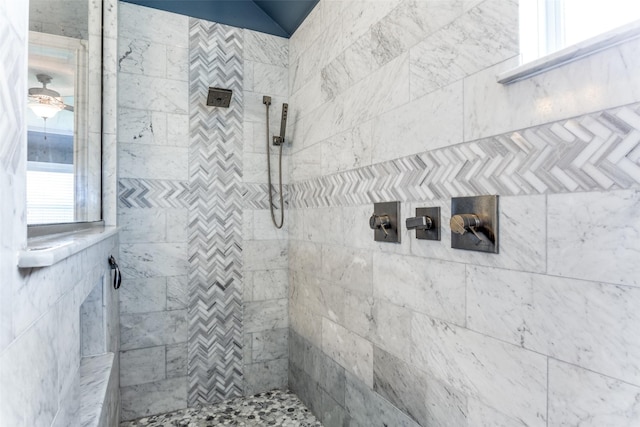 bathroom featuring tiled shower and a healthy amount of sunlight