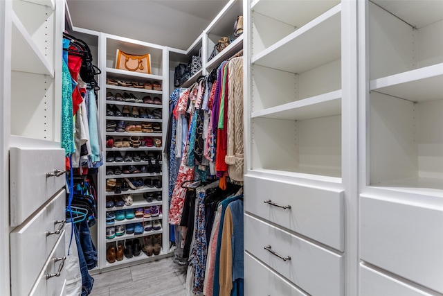 spacious closet featuring hardwood / wood-style flooring