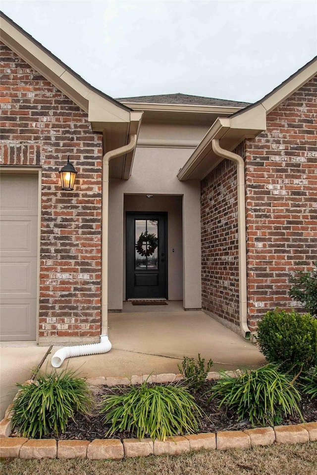 doorway to property featuring a garage