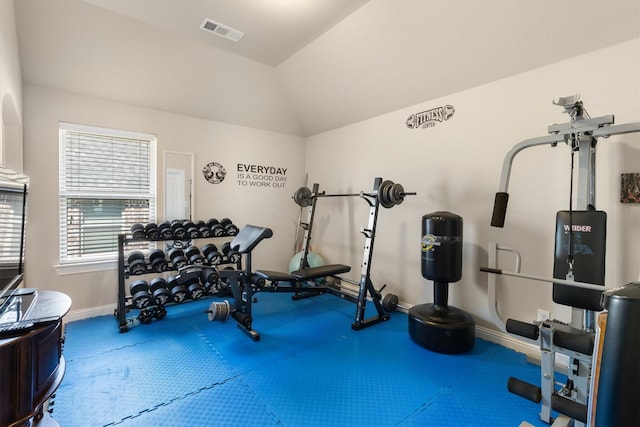 workout room featuring lofted ceiling