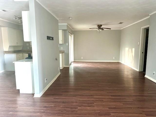 interior space featuring crown molding, dark hardwood / wood-style floors, and ceiling fan