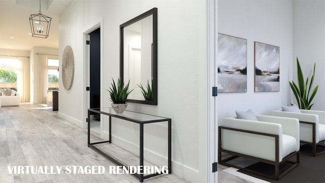 corridor with a notable chandelier and light hardwood / wood-style flooring