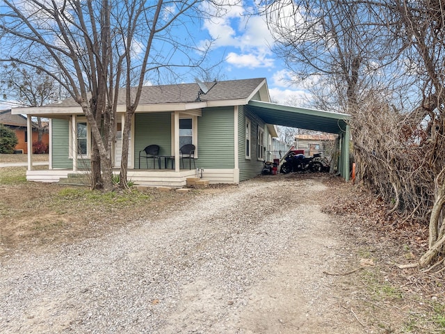 view of front of property with a carport and covered porch